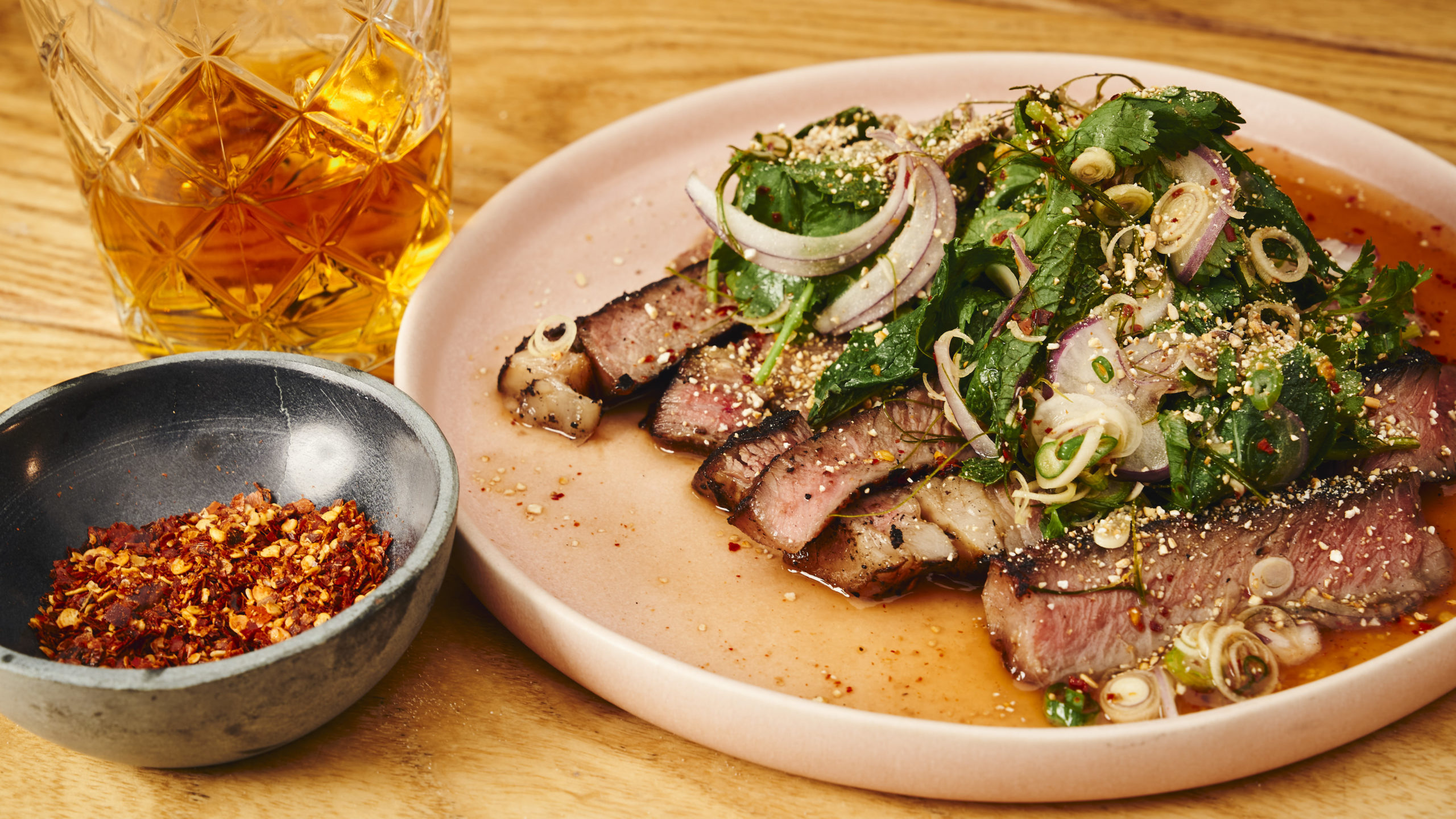 Whiskey marinated sirloin steak with salad